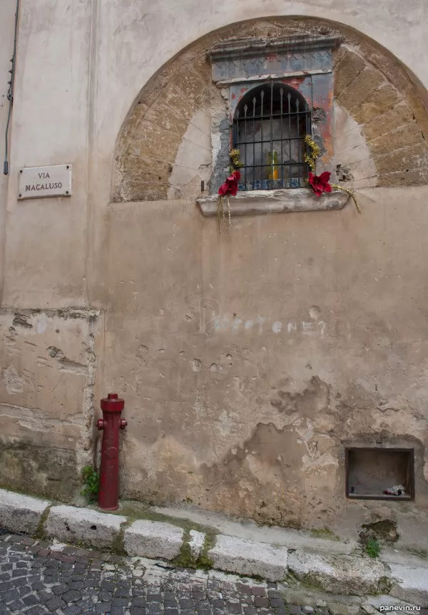 Candle in a wall