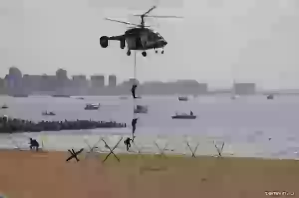 Marines landing from navy helicopter