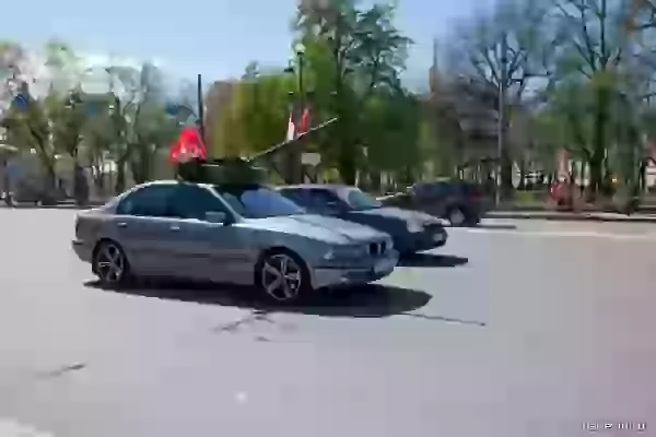 BMW with a flag of a victory and a tank tower