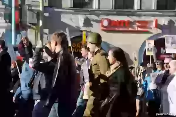 Procession of the «Immortal regiment». In a soldier's blouse and a helmet