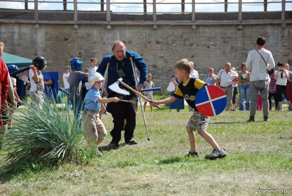 Children with wooden weapon