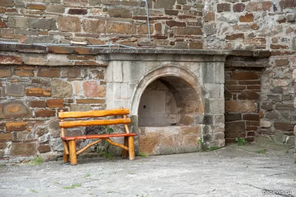 Drinking source in a wall