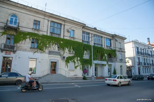 House with greens on a facade