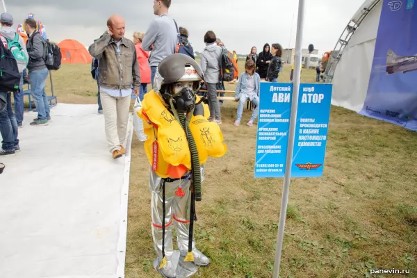 Armless boy in flight headset