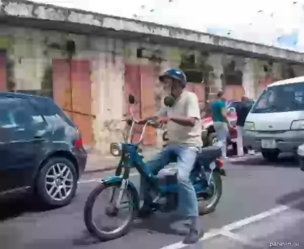  Old man on a motor scooter