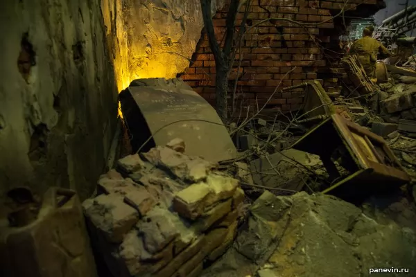 Furniture from the destroyed house and the propaganda poster