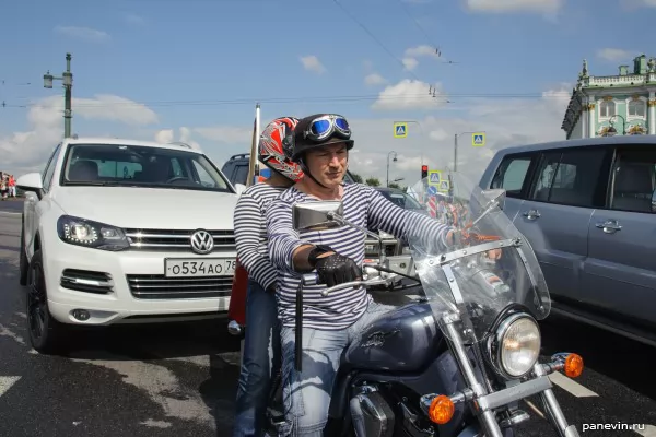 Motorcyclists in stripped suits