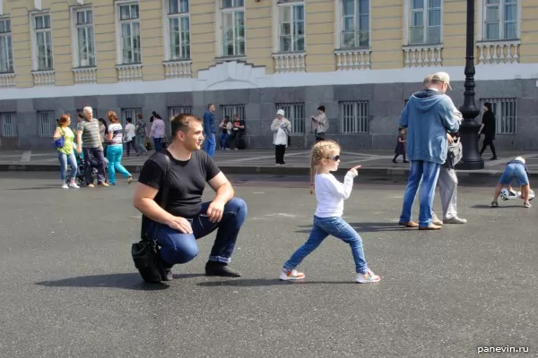 Father with a daughter pose for a photo