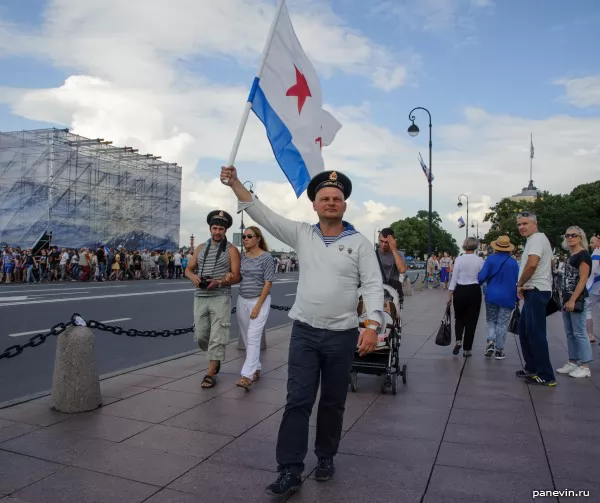 Sailor of Northern fleet with a flag of the USSR Navy