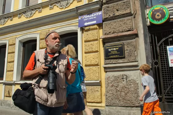 Picturesque photographer in a skullcap