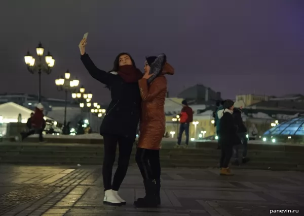 Girls made selfie on Manezhnaya Square