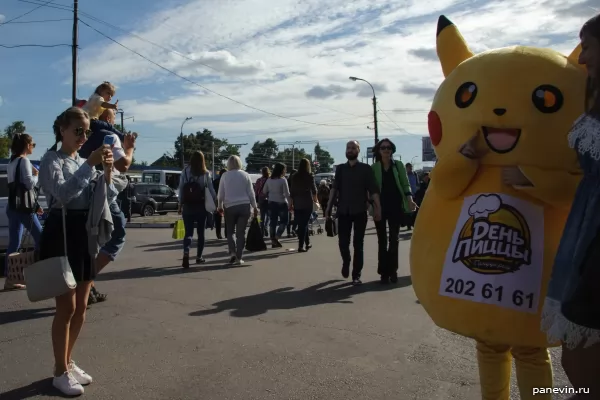 Girl is photographed with pokemon Pikachu