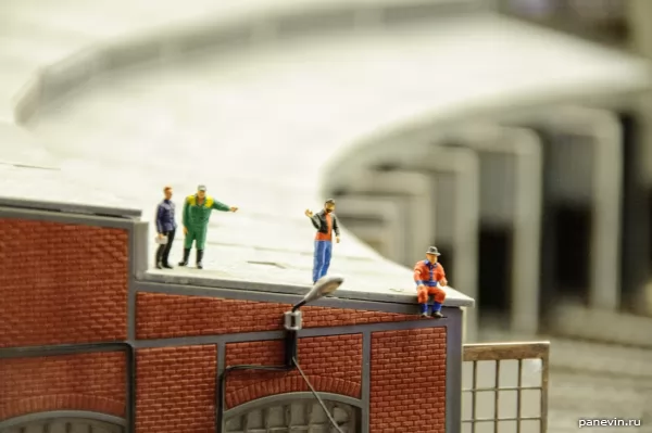 Workers on a roof of fan depot