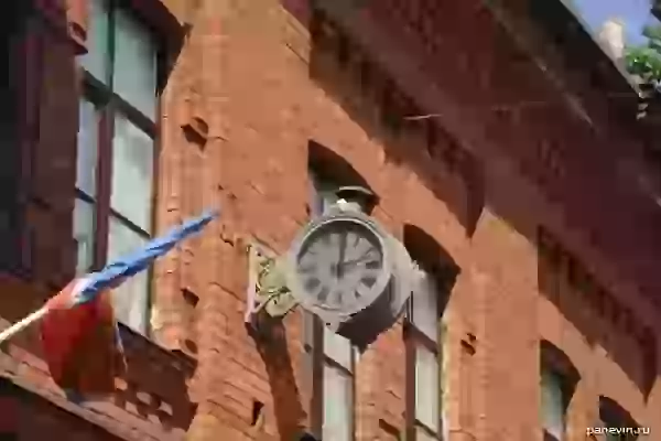 Street clock on the facade