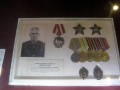 Фотография и награды пожарного Г. М. Кулакова, часть экспозиции Музея обороны Ленинграда