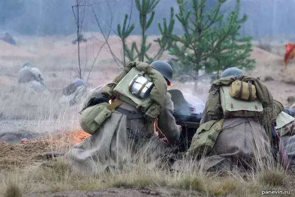 Russian machine gunners fire