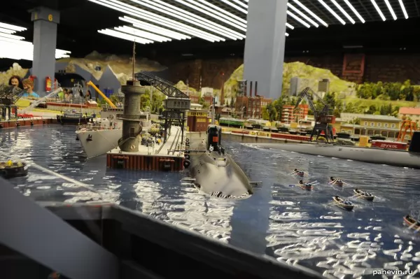 a nuclear-powered submarine at a pier