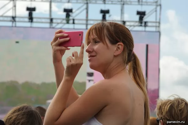 Young lady with pink phone