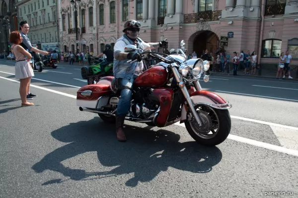 Biker welcomes a column of colleagues