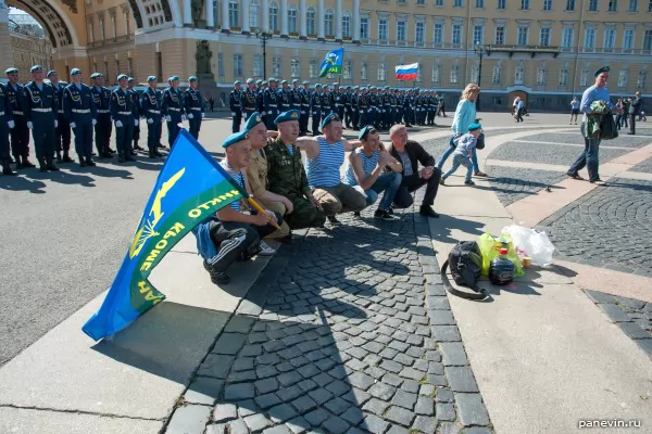 Photos for memory, against a formation of cadets