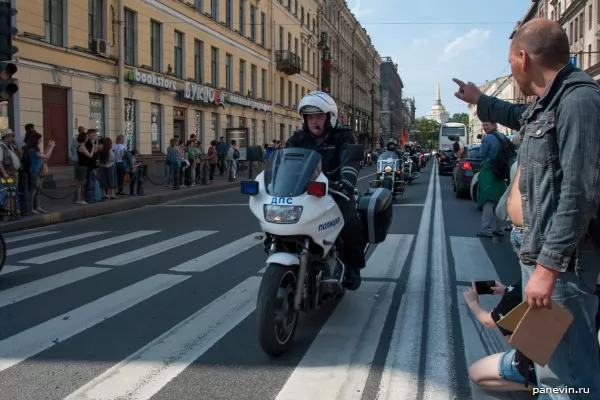 Motorcycle of traffic police and a column of bikers on Nevsky prospectus