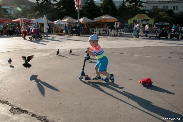 Boy on a kick scooter