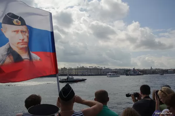 Seamen with a flag of Russia with Putin's portrait, Navy Day