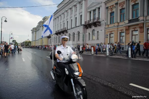 Naval officer on a motor scooter