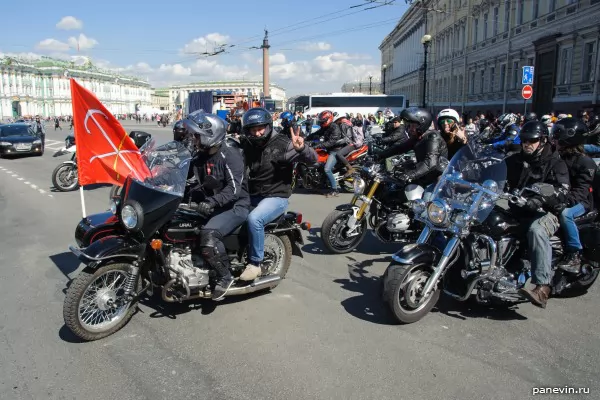 Columned bikers at Palace Square