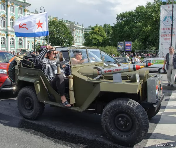 Seamen in jeep run siren