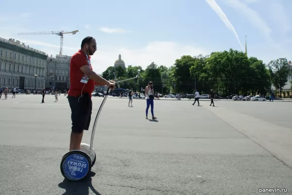 Man on Segway Fan with a Selfie Stick